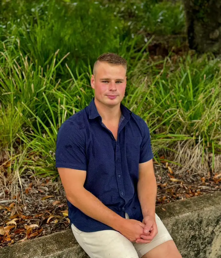 Smart Path Property team member seated outdoors