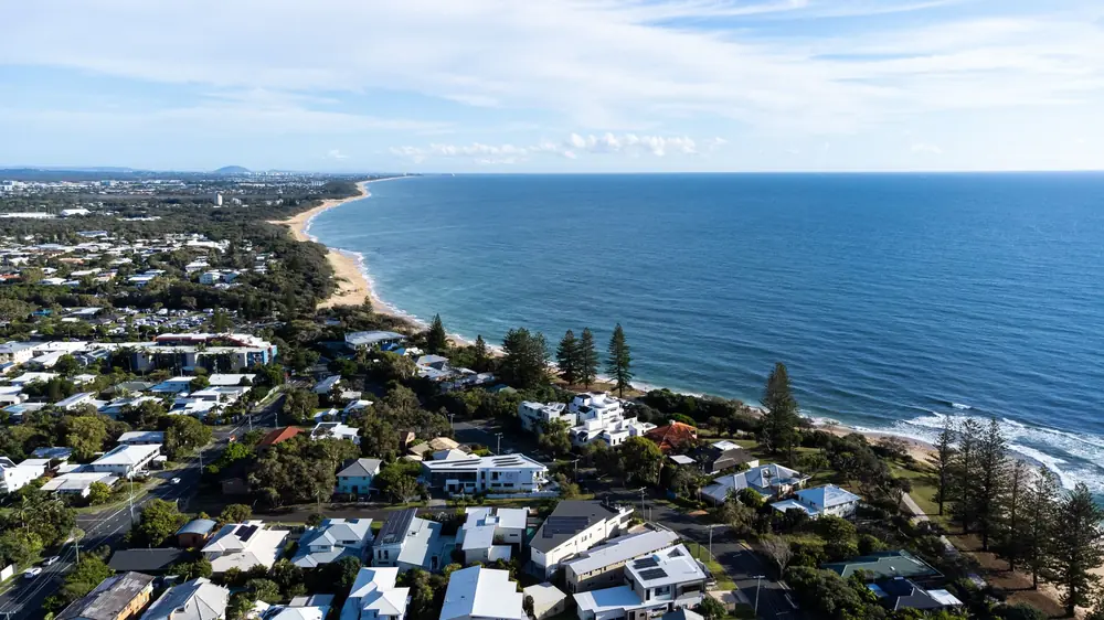 Aerial view along Caloundra coastline and residential areas