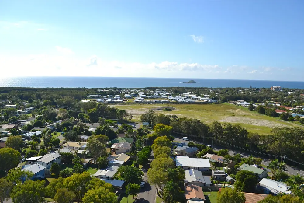 Aerial view across a coastal Sunshine Coast neighbourhood